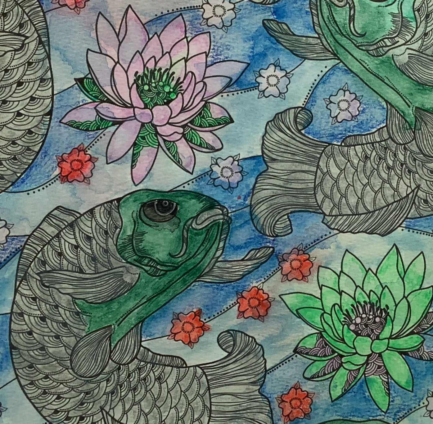 Decorative pillow with fish and lotus flower pattern on a white background